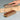 Wooden model airplane with sandpaper on a gray background