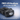 Black LED headlamp with promotional text on a blue background