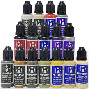 Collection of Micro Mark acrylic paint bottles in various colors on a white background