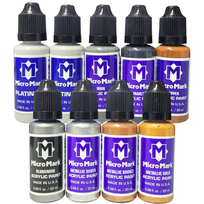 Set of Micro Mark acrylic paint bottles in various colors on a white background