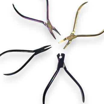 Four pairs of pliers on a white background