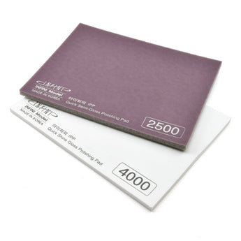 Two sanding pads with different grit numbers on a white background