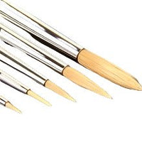 Set of paintbrushes with wooden handles on a white background
