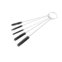 Set of five black bristle brushes on a white background