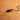 Small electronic component with wires on a brown surface