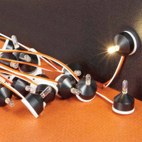 Light bulb string with multiple bulbs on a dark background