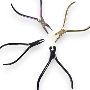 Four pairs of pliers on a white background