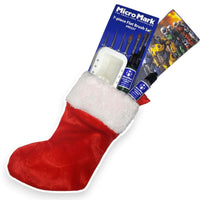 Red Christmas stocking with a flat brush set and model painting kit on a white background