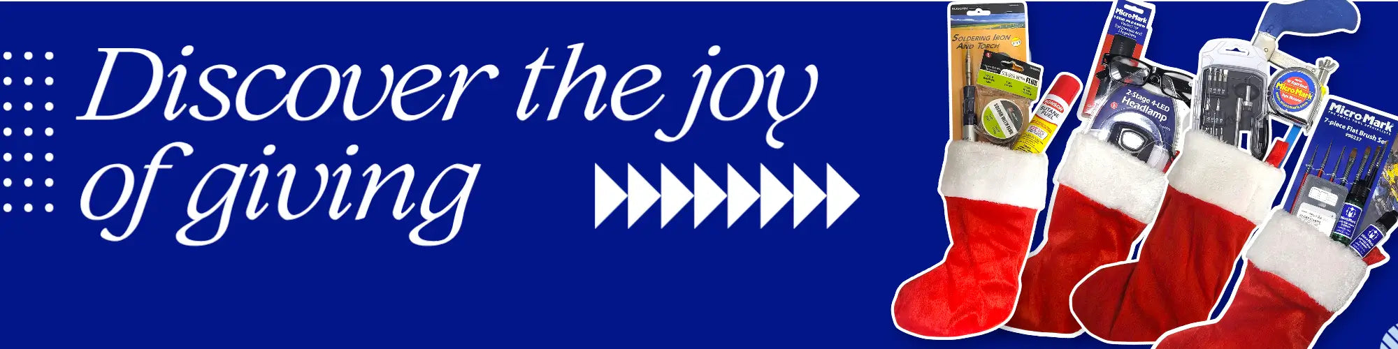 Red Christmas stockings with gift tags on a blue background with text 'Discover the joy of giving'.